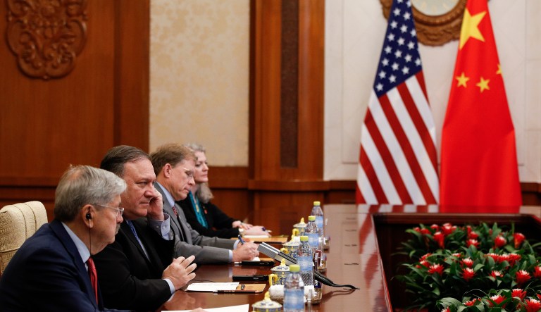 U.S. Secretary of State Mike Pompeo, second from left, listens to China's State Councilor Yang Jiechi's speech during their meeting at the Diaoyutai State Guesthouse in Beijing, Monday, Oct. 8, 2018.