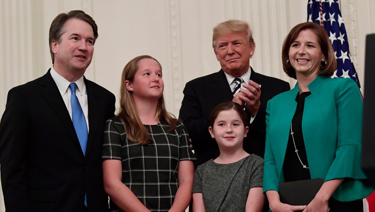 President Trump and the audience, applaud Supreme Court Justice Brett Kavanaugh and his family, Ashley Kavanaugh and daughters Margaret, left, and Liza.