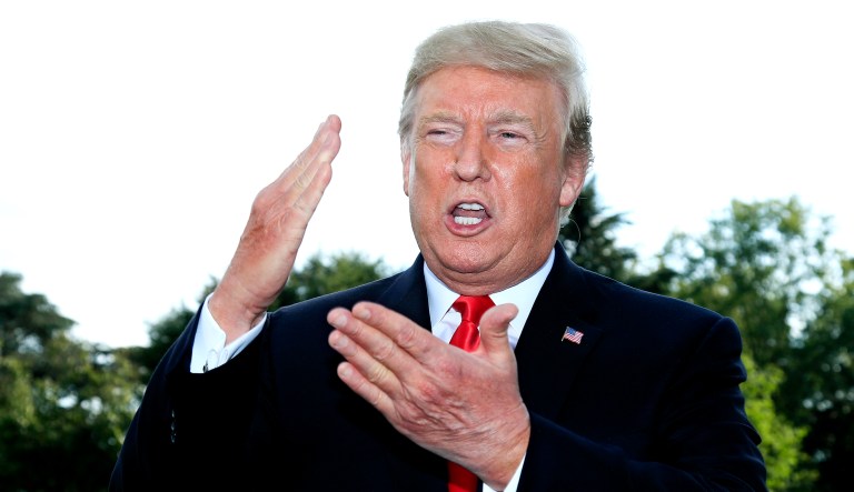 President Trump speaks to reporters on the South Lawn before leaving the White House in D.C.