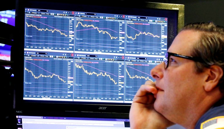 Specialist Gregg Maloney works at his post on the floor of the New York Stock Exchange on Wednesday. Stocks are extending their slump on Wall Street, led by drops in big technology companies, as rising bond yields draw investors out of stocks. 