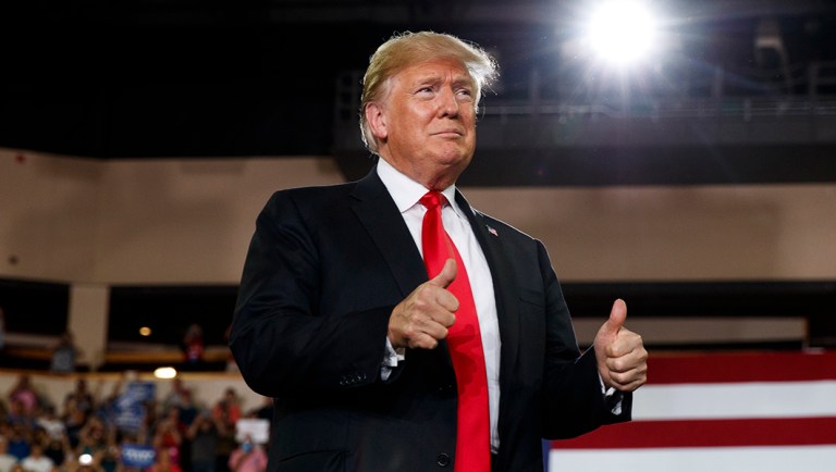 President Trump arrives to speak at a campaign rally at Erie Insurance Arena.