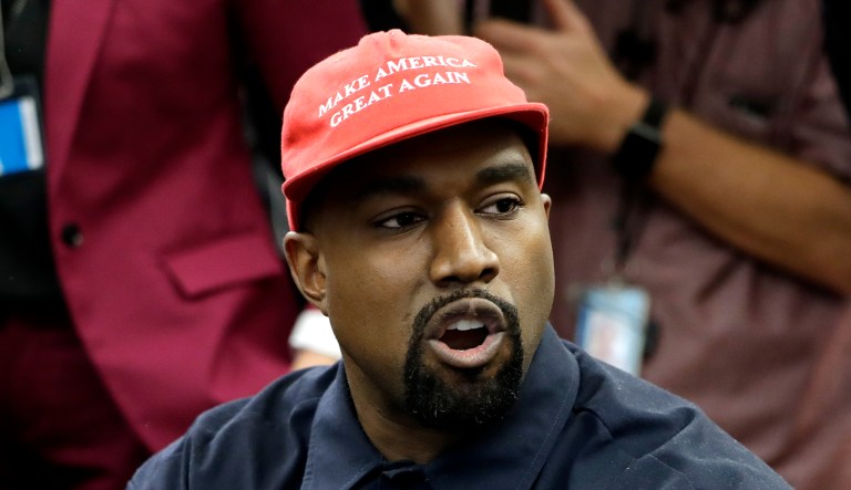 Rapper Kanye West speaks to President Trump and others in the Oval Office of the White House in Washington.