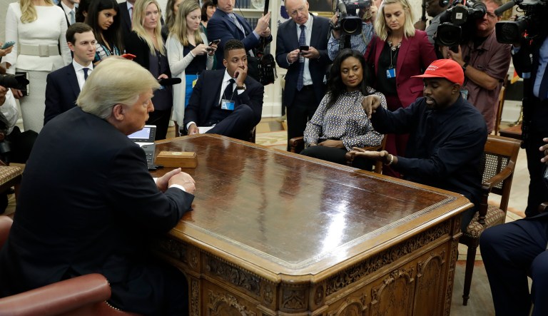 Rapper Kanye West speaks to President Donald Trump and others in the Oval Office of the White House, Thursday, Oct. 11, 2018, in Washington.