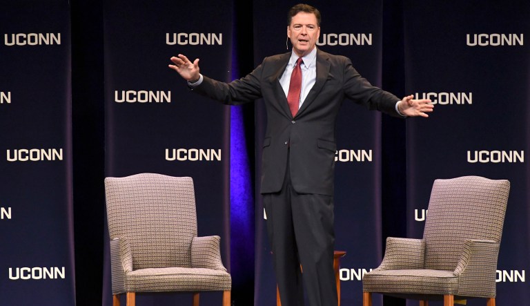 Former Director of the FBI James Comey speaks at the Jorgensen Center for the Performing Arts on the UConn campus in Storrs, Conn., Monday night, Oct. 15, 2018. UConn President Susan Herbst, right, joined Comey for the second half of his speech.