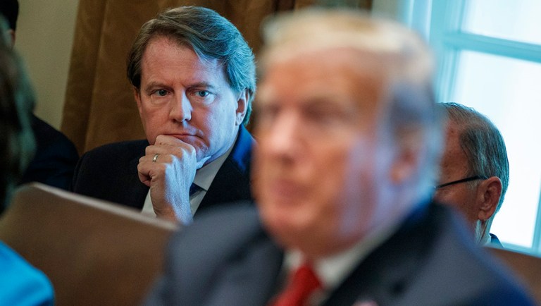 White House counsel Don McGahn looks on as President Trump speaks.