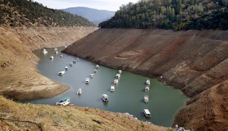 In this Thursday, Oct. 30, 2014, file photo, houseboats float in the drought-lowered waters of Oroville Lake near Oroville, Calif. Lake Oroville, the State Water Project's principal reservoir, is dipping toward its record low set in 1977.