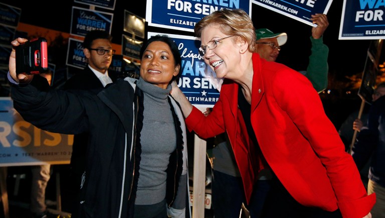 Sen. Elizabeth Warren, D-Mass., poses for a selfie while greeting supporters.