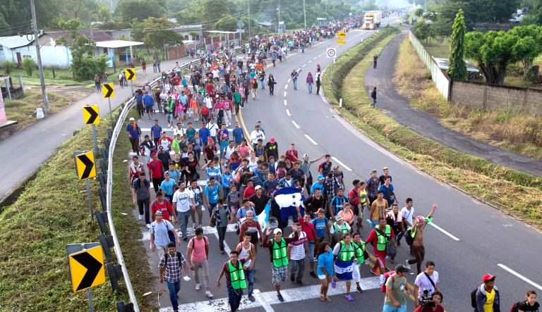 Central American migrants walking to the U.S. start their day departing Ciudad Hidalgo, Mexico, on Oct. 21, 2018.