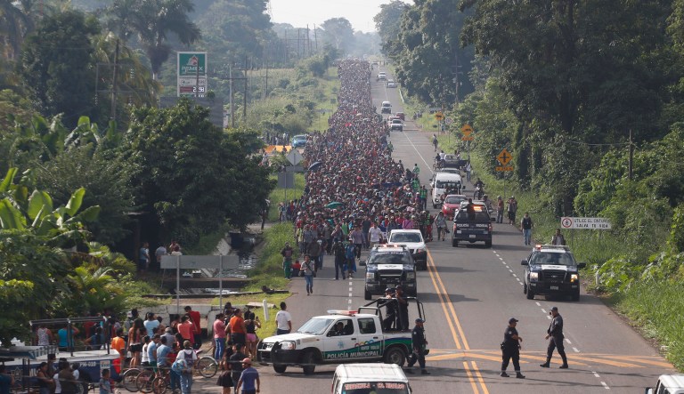 Central American migrants walking to the U.S. start their day departing Ciudad Hidalgo, Mexico, Sunday, Oct. 21, 2018. Despite Mexican efforts to stop them at the border, about 5,000 Central American migrants resumed their advance toward the U.S. border early Sunday in southern Mexico.