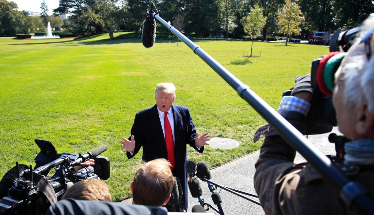 President Trump speaks to reporters before leaving the White House in Washington, Monday, Oct. 22, 2018, to attend a campaign rally in Houston, Texas.