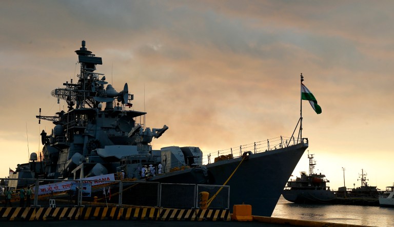 Indian Naval Ship INS Rana, a destroyer prepares to dock at Manila's South Harbor for a four-day port call at sunset Tuesday, Oct. 23, 2018 in Manila, Philippines.The Indian multi-role guided missile destroyer, with a crew of more than 300 and commanded by Capt. Atul Deswal, is here on a routine port call which is aimed at strengthening ties between the two countries.