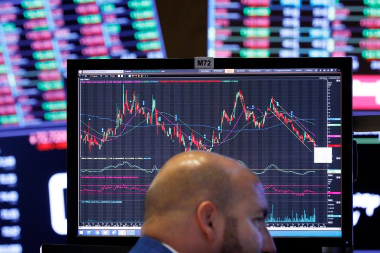 Specialist John Parisi works at his post on the floor of the New York Stock Exchange, Tuesday, Oct. 23, 2018. U.S. stocks slumped broadly on Wall Street Tuesday, sending the Dow Jones Industrial Average down 400 points and extending the market's recent string of losses. 