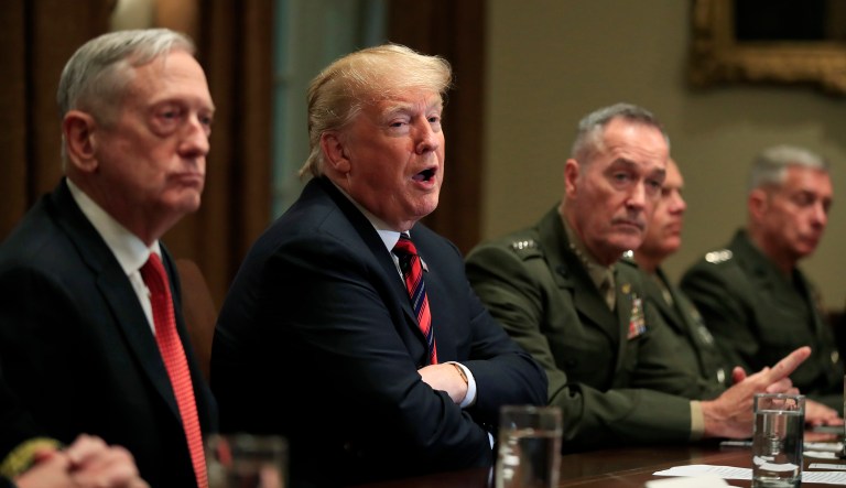 President Trump with, from left, Defense Secretary Jim Mattis, Trump, Chairman of the Joint Chiefs of Staff Gen. Joseph Dunford and Marine Corps Commandant Gen. Robert Neller, speaks during a briefing with senior military leaders in the Cabinet Room at the White House in Washington, Tuesday, Oct. 23, 2018. 