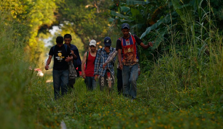 A small group of Honduran migrants trying to reach the U.S. border walk along train tracks in Trancas Viejas, Veracruz state, Wednesday, Oct. 24, 2018. As a caravan of thousands of Central Americans renewed their slow march toward the U.S. on Wednesday, others chose to travel in smaller groups following routes well-worn by decades of migrants fleeing poverty and violence.