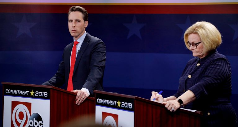 Missouri U.S. Senate candidates incumbent Democratic Sen. Claire McCaskill, right, and Republican challenger Josh Hawley wait for the start of a debate Thursday, Oct. 25, 2018, in Kansas City, Mo.