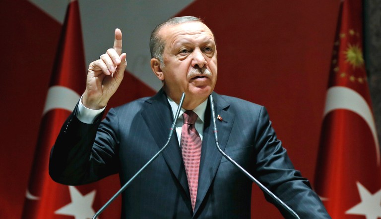 Turkey's President Recep Tayyip Erdogan talks to members of his ruling Justice and Development Party in Ankara, Turkey, on Friday.