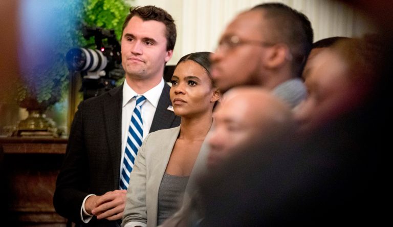 Conservative commentator and conservative advocacy group Turning Point USA Director of Communications Candace Owens, center, listens as President Donald Trump speaks at the 2018 Young Black Leadership Summit at the White House, Friday, Oct. 26, 2018.