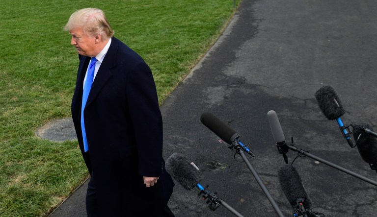 President Trump walks away from the microphones after taking with reporters on the South Lawn of the White House in Washington, Friday, Oct. 26, 2018.
