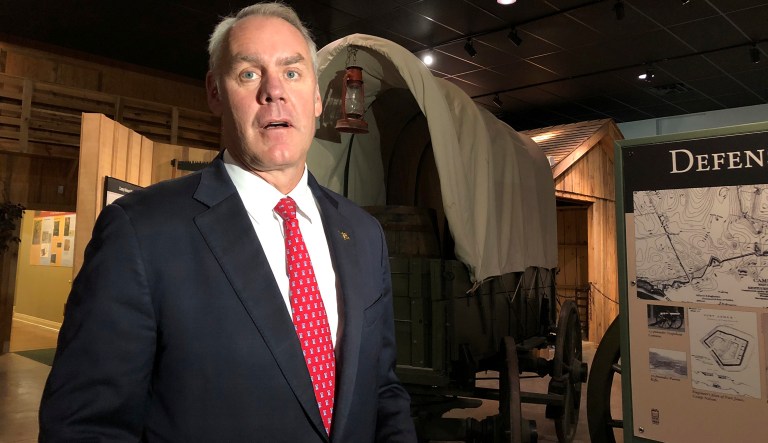 U.S. Interior Secretary Ryan Zinke speaks with reporters at the Camp Nelson National Monument on Saturday, Oct. 27, 2018, in Nicholasville, Kentucky. Camp Nelson was a Union Army depot during the U.S. Civil War and was a recruiting center for black soldiers. Zinke announced Saturday Camp Nelson has been officially designated as a national monument.