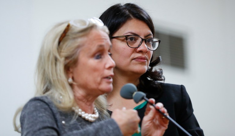 Rashida Tlaib, right, Democratic candidate for Michigan's 13th Congressional District listens to Rep. Debbie Dingell, D-Mich., speak in Dearborn, Mich., Friday, Oct. 26, 2018.