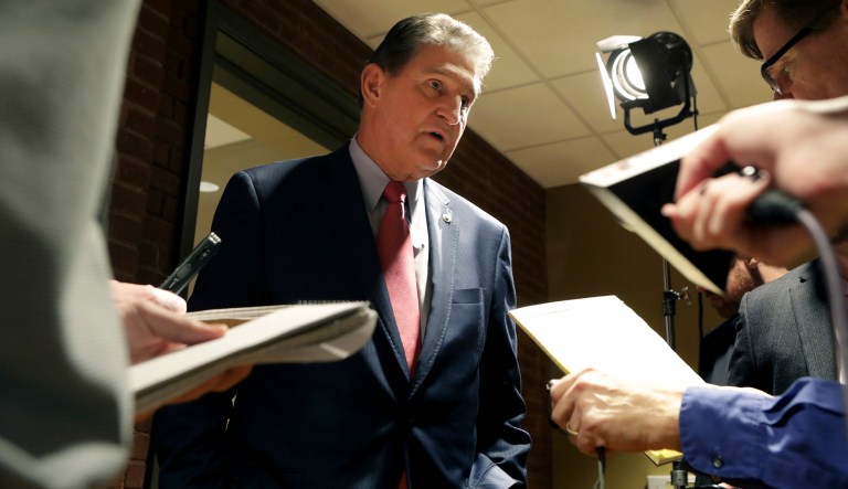 In this Nov. 1, 2018 photo, Sen. Joe Manchin speaks to reporters after a debate with Patrick Morrisey in Morgantown, W.Va. Republicans have a huge advantage as they seek to hold or expand their 51-49 Senate majority, with the battle for control running mostly through states that President Donald Trump won in 2016.