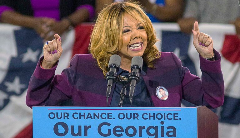 FILE - In a Friday, Nov. 2, 2018 file photo, Democrat Lucy McBath speaks during a rally for Democratic gubernatorial candidate Stacey Abrams, at Morehouse College in Atlanta. McBath and GOP Rep. Rob Woodall faced a risk of losing their seats Wednesday, Nov. 7, 2018 as election returns showed them in perilously tight races with Democratic challengers in a pair of suburban Atlanta districts long considered safe for the GOP.