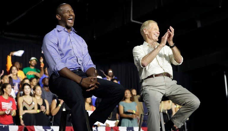 Democratic gubernatorial candidate Andrew Gillum, left, and U.S. Sen. Bill Nelson, D-Fla., right, listen as Former President Barack Obama speaks during a campaign rally, Friday, Nov. 2, 2018, in Miami.