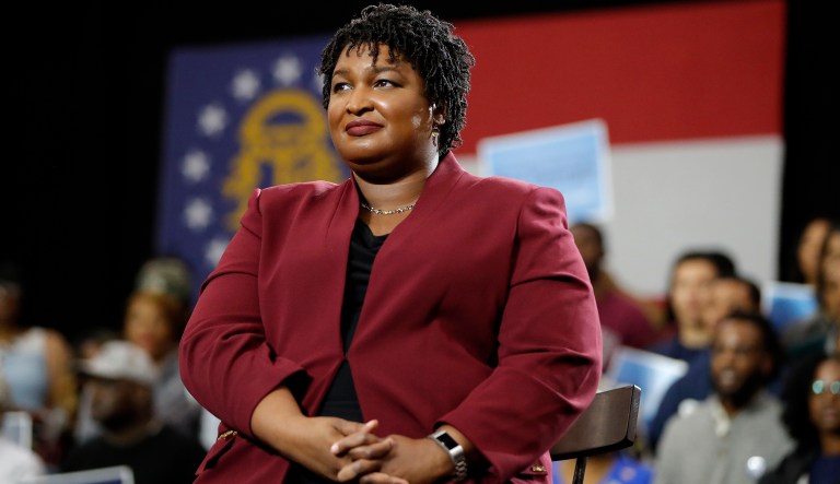 Georgia gubernatorial candidate Stacey Abrams watch as former President Barack Obama speaks during a campaign rally at Morehouse College Friday, Nov. 2, 2018, in Atlanta.