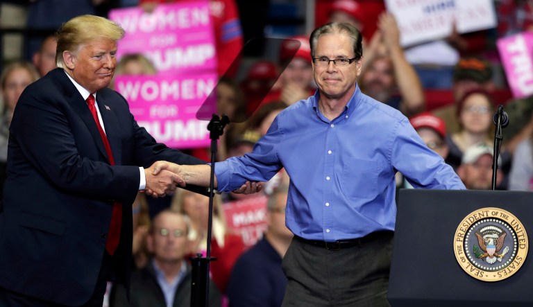 President Trump greets Senate candidate Mike Braun at a campaign rally at the Allen County War Memorial Coliseum in Fort Wayne, Ind., Monday, Nov. 5, 2018.