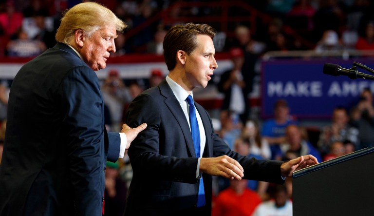 Republican Senate candidate Josh Hawley is guided to the podium to speak by President Donald Trump during a rally at Show Me Center, Monday, Nov. 5, 2018, in Cape Girardeau, Mo.