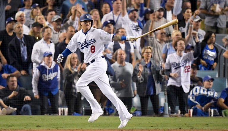 In this Oct. 26, 2018 photo, Los Angeles Dodgers' Manny Machado watches his single against the Boston Red Sox during the sixth inning in Game 3 of the baseball World Series in Los Angeles. 