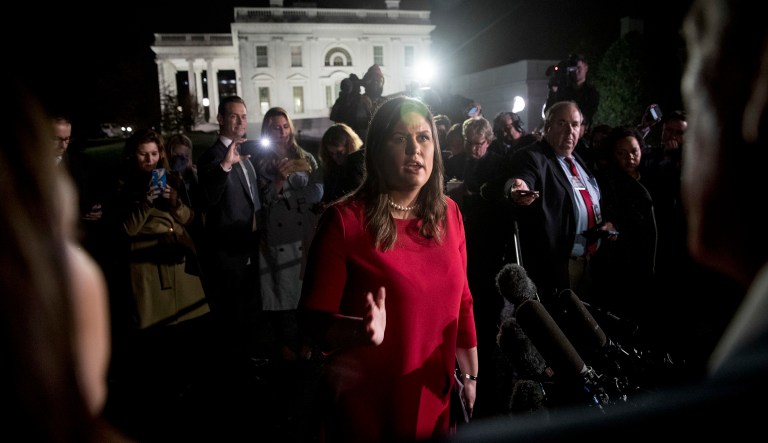 White House press secretary Sarah Huckabee Sanders speaks to members of the media on election night outside the West Wing of the White House in Washington, Tuesday, Nov. 6, 2018.