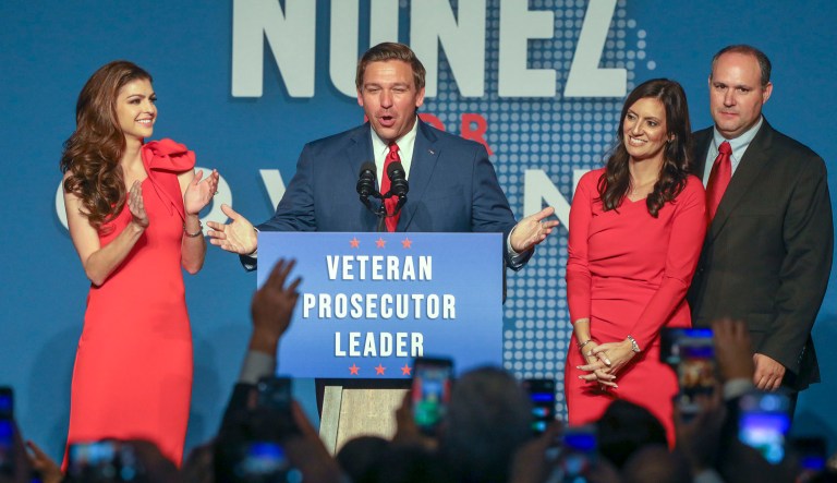 Republican Florida Governor-elect Ron DeSantis speaks as his wife Casey, left, Lt. Governor-elect Jeanette Nunez and her husband Adrian Nunez look on Tuesday, Nov. 6, 2018 in Orlando, Fla. DeSantis defeated Democratic gubernatorial candidate Andrew Gillum. 