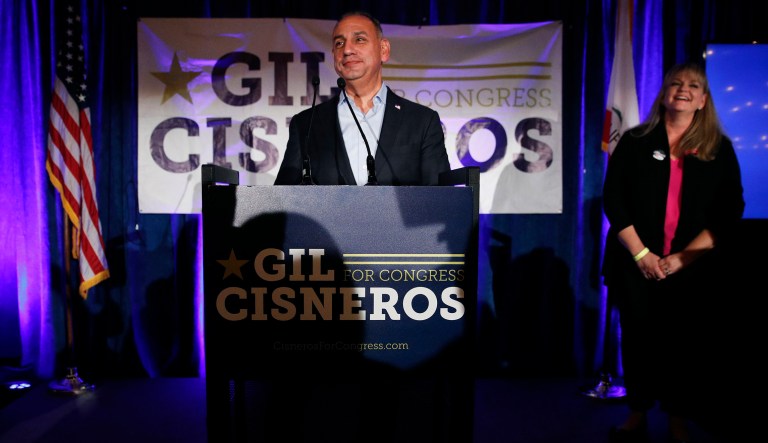 Democratic candidate for California's 39th Congressional District, Gil Cisneros, center, addresses supporters as he is joined by wife, Jacki, at an election night party Tuesday, Nov. 6, 2018, in Fullerton, Calif.