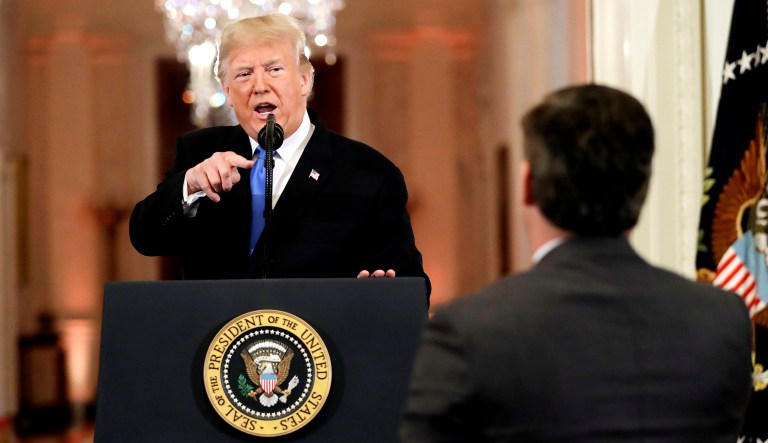 President Trump speaks with CNN White House correspondent Jim Acosta during a news conference in the East Room of the White House in D.C.