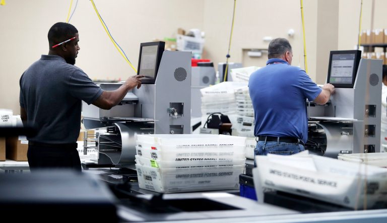 Employees at the Broward County Supervisor of Elections office count ballots from the 2018 midterm election on Thursday in Lauderhill, Fla. 