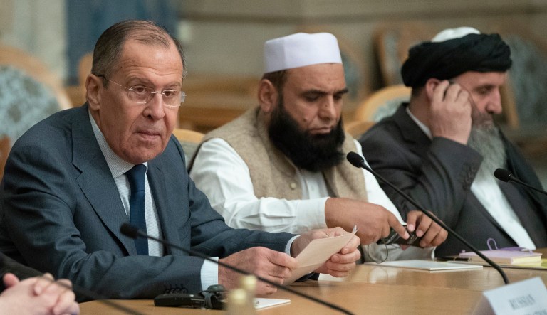 Russian Foreign Minister Sergey Lavrov, left, speaks as he attends a conference on Afghanistan bringing together representatives of the Afghan authorities and the Taliban in Moscow, Friday, Nov. 9, 2018.