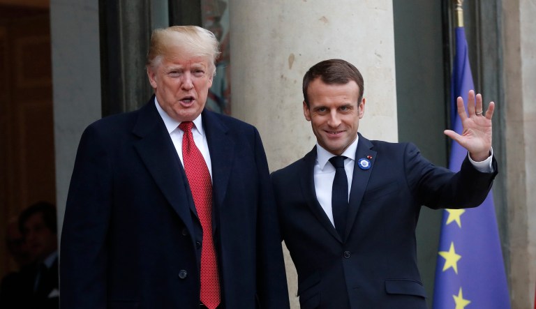 French President Emmanuel Macron (right) welcomes President Trump at the Elysee Palace in Paris, Saturday. Trump is joining other world leaders at centennial commemorations in Paris this weekend to mark the end of World War I. 