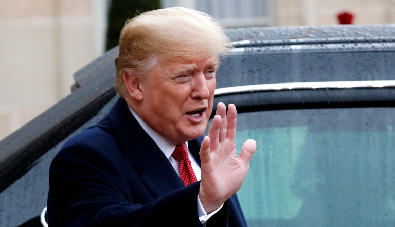 President Trump gestures outside the Elysee Palace after his talks with French President Emmanuel Macron in Paris on Saturday.