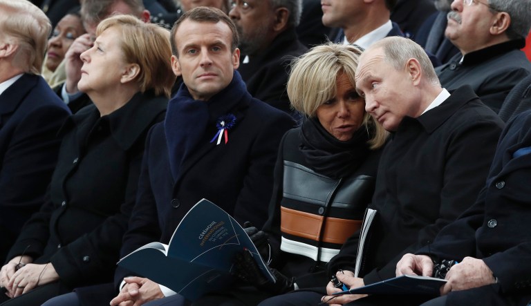 Russian President Vladimir Putin, Brigitte Macron, French President Emmanuel Macron, and German Chancellor Angela Merkel attend a commemoration ceremony for Armistice Day, 100 years after the end of the First World War at the Arc de Triomphe in Paris, Sunday, Nov. 11, 2018. 