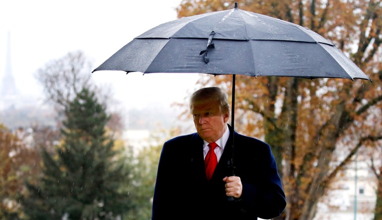 President Trump stands among the headstones during an American Commemoration Ceremony on Sunday at Suresnes American Cemetery near Paris.