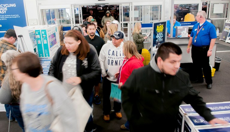 Shoppers enter a Best Buy looking for early Black Friday deals on Thanksgiving Day in Bowling Green, Kentucky, on Nov. 23, 2017.