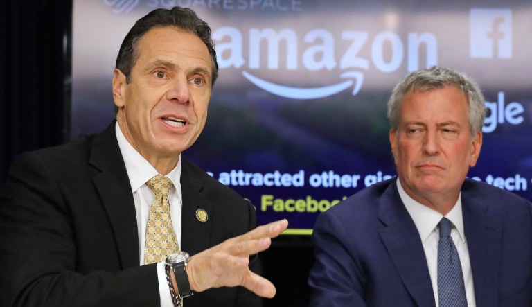 New York Gov. Andrew Cuomo, left, and New York City Mayor Bill de Blasio hold a news conference Tuesday Nov. 13, 2018, in New York. Amazon said it will split its much-anticipated second headquarters between New York and northern Virginia. Its New York location will be in the Long Island City neighborhood of Queens.