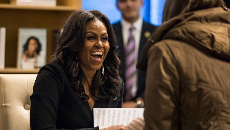 Former first lady Michelle Obama signs copies of her new book "Becoming" and greets fans as she kicks off a national book tour.