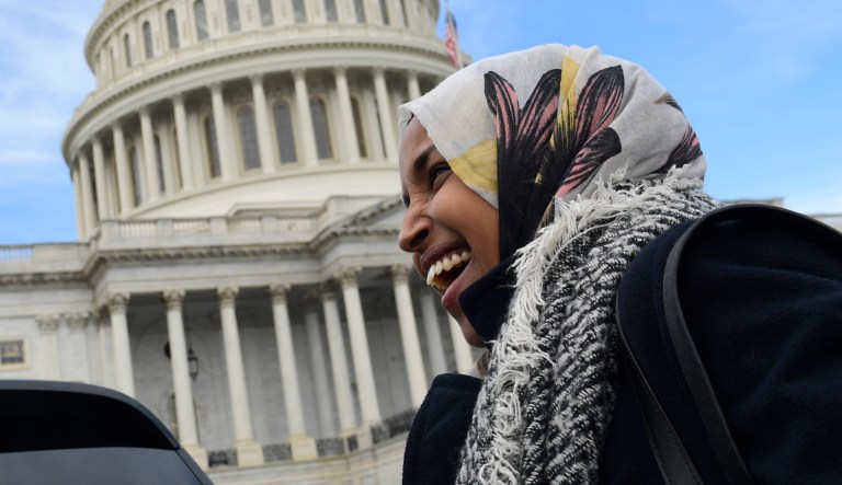 Rep.-elect Ilhan Omar, D-Minn., smiles during an interview following a photo opportunity on Capitol Hill in Washington, Wednesday, Nov. 14, 2018, with the freshman class.