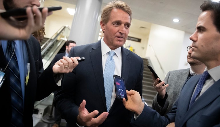 Sen. Jeff Flake, R-Ariz., speaks with reporters before he and Sen. Chris Coons, D-Del., try to bring up the legislation to protect special counsel Robert Mueller, at the Capitol in Washington, Wednesday, Nov. 14, 2018. Senate Republicans are facing renewed pressure to pass legislation to protect Mueller, with a handful of GOP senators urging their leadership to hold a vote now that President Donald Trump has pushed out Attorney General Jeff Sessions.