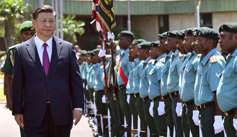 China's President Xi Jinping inspects guards at Parliament House in Port Moresby, Papua New Guinea, Friday, Nov. 16, 2018, ahead of the Asia-Pacific Economic Cooperation summit.