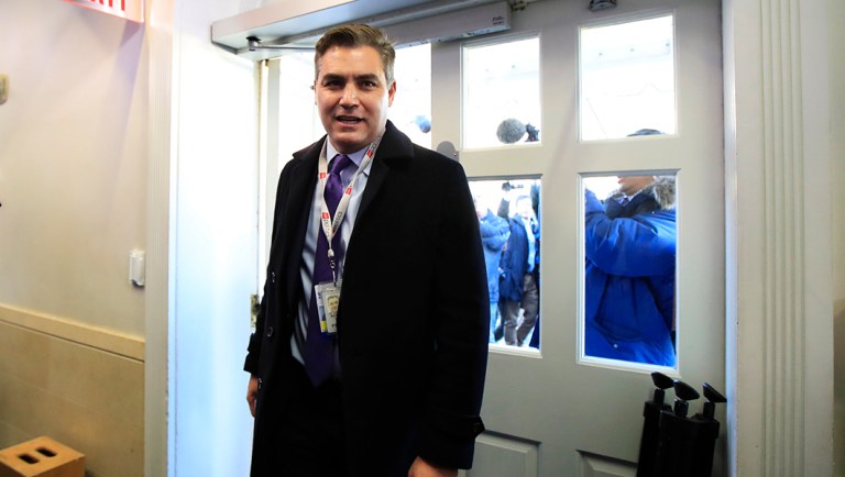 CNN's Jim Acosta enters the Brady press briefing room upon returning back to the White House in Washington.