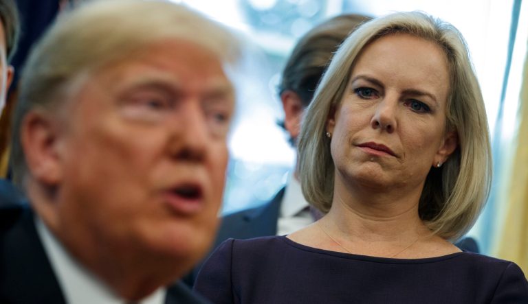 Secretary of Homeland Security Kirstjen Nielsen looks on as President Donald Trump speaks in the Oval Office of the White House, Friday, Nov. 16, 2018, in Washington. 