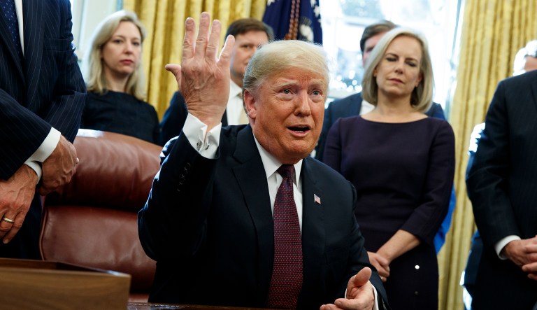 President Trump answers a reporters question about the investigation of special counsel Robert Mueller during a signing ceremony at the White House in D.C.